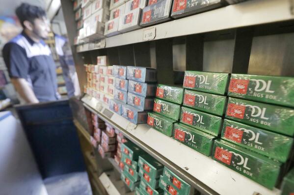 FILE - This May 17, 2018 file photo shows packs of menthol cigarettes and other tobacco products at a store in San Francisco.   As federal officials finalize a long-awaited plan to ban menthol cigarettes, dozens of interest groups have met with White House staffers to try and influence the process, which has the potential to save thousands of lives while wiping out billions in tobacco sales.  (AP Photo/Jeff Chiu, File)