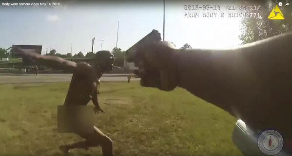 This still image taken from the Richmond, Va., Police body camera shows a police officer pointing his gun at Marcus-David Peters on May 14, 2018, in Richmond, Va. Police Chief Alfred Durham on Friday, May 25, released the video showing the officer first used a stun gun when Peters approached him. Police say it was not effective and the officer then shot Peters twice in the abdomen. (Richmond Police via AP)