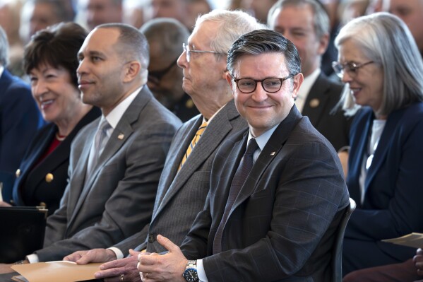 Speaker of the House Mike Johnson, R-La., right, smiles as he is joined by, from left, Sen. Susan Collins, R-Maine, House Minority Leader Hakeem Jeffries, D-N.Y., and Senate Minority Leader Mitch McConnell, R-Ky., as they attend a Congressional Gold Medal ceremony for surviving members of a top-secret WWII unit, at the Capitol in Washington, Thursday, March 21, 2024. (AP Photo/J. Scott Applewhite)