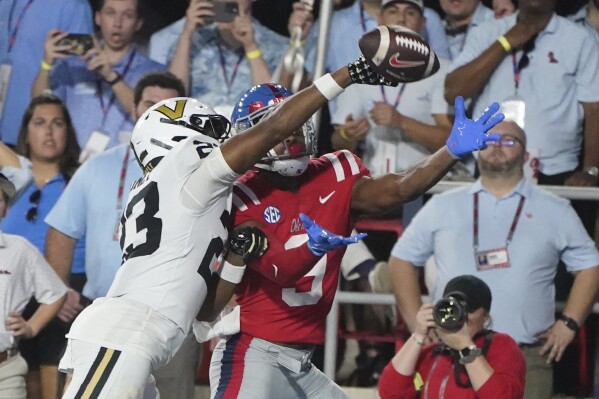 Vanderbilt defensive back Jaylen Mahoney (23) knocks a pass away from Mississippi wide receiver Tre Harris (9) during the first half of an NCAA college football game in Oxford, Miss., Saturday, Oct. 28, 2023. (AP Photo/Rogelio V. Solis)