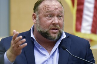 FILE - Conspiracy theorist Alex Jones takes the witness stand to testify at the Sandy Hook defamation damages trial at Connecticut Superior Court in Waterbury, Conn. Thursday, Sept. 22, 2022. A Texas judge has ruled that Jones cannot use bankruptcy protection to avoid paying nearly $1 billion to families who sued over his conspiracy theories that the Sandy Hook school massacre was a hoax. (Tyler Sizemore/Hearst Connecticut Media via AP, Pool, File)