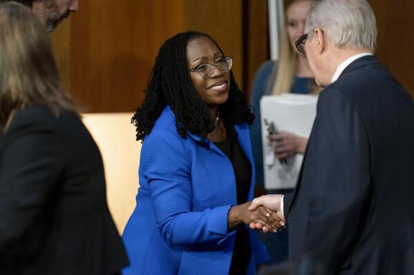 Supreme Court nominee Ketanji Brown Jackson shakes hands with Chairman Sen. Dick Durbin, D-Ill., right, as she departs following her Senate Judiciary Committee confirmation hearing on Capitol Hill in Washington, Wednesday, March 23, 2022. (AP Photo/Andrew Harnik)