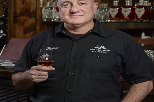 
              In this 2017 photo provided by Golden Moon Distillery, Steve Gould poses for a photo in Golden, Colo. Before Europe retaliated against new U.S. tariffs with taxes of its own, Gould expected export revenue at his Golden Moon Distillery in Colorado to grow 15 percent to about 25 percent this year. Now he’s concerned. Golden Moon already saw an effect when then-candidate Donald Trump made trade an issue during the 2016 campaign. Gould lost one of his Mexican importers and an investor, as overseas demand for small-distiller spirits was growing. (Sounders Studios/Golden Moon Distillery via AP)
            