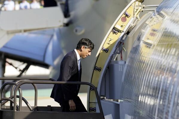 Britain's Prime Minister Rishi Sunak climbs the steps to his plane at San Diego International Airport as he heads back to the United Kingdom after a meeting with U.S. President Joe Biden and Prime Minister of Australia Anthony Albanese, Monday, March 13, 2023, as part of AUKUS, a trilateral security pact between Australia, the UK, and the U.S. (Stefan Rousseau/Pool Photo via AP)