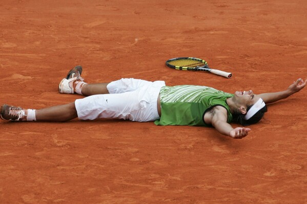 FILE - Spain's Rafael Nadal reacts as he defeats Argentina's Mariano Puerta during their final match of the French Open tennis tournament at Roland Garros stadium, Sunday June 5, 2005, in Paris. Nadal beat Puerta 6-7 (6), 6-3, 6-1, 7-5 to win. (AP Photo/Christophe Ena, File)