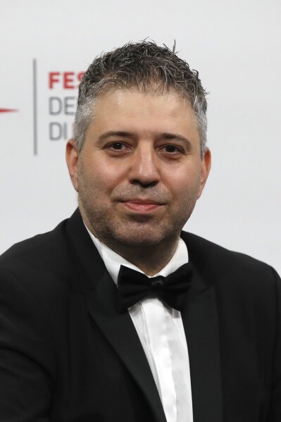 Director Evgeny Afineevsky poses for photographers during the photo call for the movie "Francesco" at the Rome Film Festival, in Rome, Wednesday, Oct. 21, 2020. (AP Photo/Alessandra Tarantino)