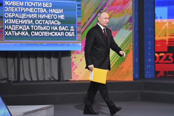 Russian President Vladimir Putin arrives to attend his annual news conference in Moscow, Russia, Thursday, Dec. 14, 2023. (Aleksander Kazakov, Sputnik, Kremlin Pool Photo via AP)