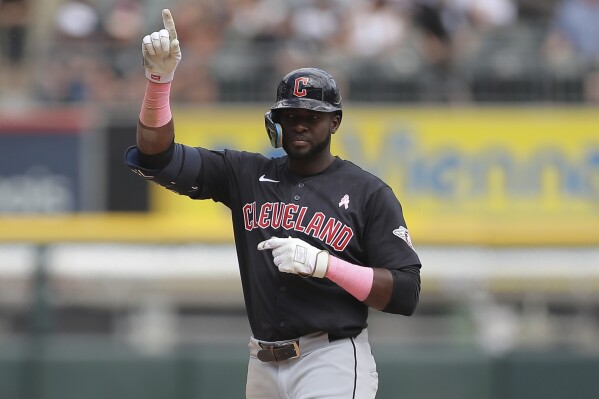 Cleveland Guardians' Estevan Floria reacts after hitting an RBI double during the sixth inning of a baseball game against the Chicago White Sox, Sunday, May 12, 2024, in Chicago. (AP Photo/Melissa Tamez)