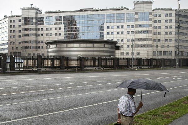 
              FILE - In this Saturday, July 14, 2018 file photo, a man walks past the building of the Main Directorate of the General Staff of the Armed Forces of Russia, also know as Russian military intelligence service in Moscow, Russia. The Russian military intelligence service GRU with a brutish reputation is increasingly taking on high-profile, high-risk operations to damage Russia’s enemies, or simply strike fear. (AP Photo/Pavel Golovkin, File)
            