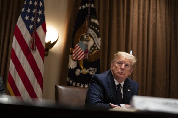President Donald Trump listens during a meeting on opportunity zones in the Cabinet Room of the White House, Monday, May 18, 2020, in Washington. (AP Photo/Evan Vucci)