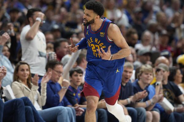 Denver Nuggets guard Jamal Murray reacts after hitting a basket against the Phoenix Suns in the second half of Game 1 of an NBA second-round basketball series Saturday, April 29, 2023, in Denver. (AP Photo/David Zalubowski)