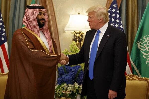 
              FILE - In this May 20, 2017, file photo, President Donald Trump shakes hands with Saudi Deputy Crown Prince and Defense Minister Mohammed bin Salman in Riyadh. In emails obtained by The Associated Press, George Nader claims he later met with Mohammed bin Salman, who by then had been elevated to crown prince, and Abu Dhabi’s crown prince, Sheikh Mohammed bin Zayed Al Nahyan, in a lobbying effort to alter U.S. policy in the Middle East. (AP Photo/Evan Vucci, File)
            