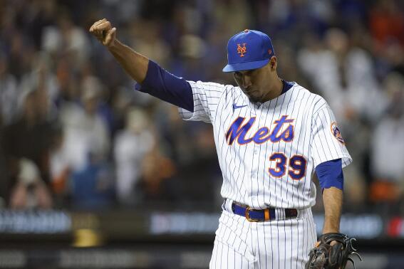 New York Mets relief pitcher Edwin Diaz (39) reacts as he walks off the field during the eighth inning of Game 2 of a National League wild-card baseball playoff series against the San Diego Padres, Saturday, Oct. 8, 2022, in New York. (AP Photo/John Minchillo)