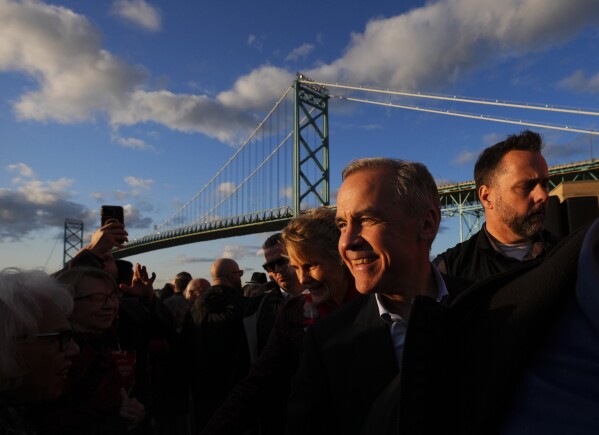 Liberal Leader Mark Carney holds a rally beside the Ambassador Bridge in Windsor, Ontario, Canada, on Saturday, April 26, 2025. (Sean Kilpatrick/The Canadian Press via AP)