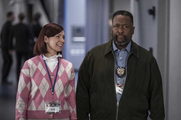 This image released by CBS shows Carrie Preston, left, and Wendell Pierce in a scene from "Elsbeth." (Michael Parmelee/CBS via AP)