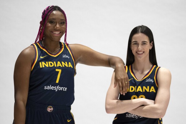 Indiana Fever's Aliyah Boston, left, and Caitlin Clark pose for a photo during the Indiana Fever media day, Wednesday, May 1, 2024, in Indianapolis. (AP Photo/Darron Cummings)