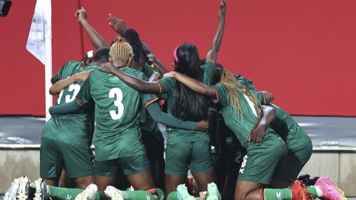 Zambian players celebrate after scoring their side's second goal during the women's international soccer match between Germany and Zambia at Sportpark Ronhof Thomas Sommer in Furth, Germany, Friday July 7, 2023. (Daniel Karmann/dpa via AP)