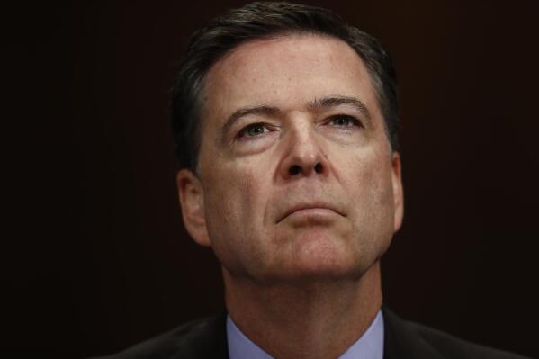 FILE- In this May 3, 2017, file photo, FBI Director James Comey listens on Capitol Hill in Washington. President Donald Trump has fired Comey. In a statement on Tuesday, May 9, Trump says Comey’s firing “will mark a new beginning” for the FBI. (AP Photo/Carolyn Kaster, File)