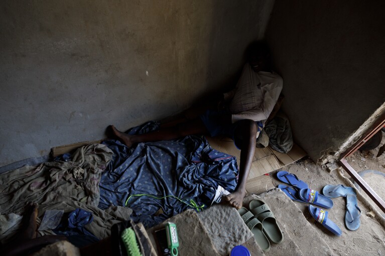 Kush users rest in a room where they receive care in an unconventional rehabilitation centre in the Bombay community, in Freetown, Sierra Leone, Thursday, April 25, 2024. Some youth in the Bombay community are helping Kush addicts stop by rehabilitating them. Over 70 drug users have received care and overcame drug abuse since January 2024. (AP Photo/ Misper Apawu)