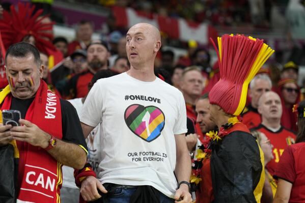 Germany's supporter wearing a rainbow jersey waits for the World Cup group F soccer match between Belgium and Canada, at the Ahmad Bin Ali Stadium in Doha, Qatar, Wednesday, Nov. 23, 2022. (AP Photo/Martin Meissner)