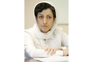 FILE - Iranian activist Narges Mohammadi, delegate of the Center for Human Rights Defenders, appears at a press conference on the Assessment of the Human Rights Situation in Iran, at the UN headquarters in Geneva, Switzerland on June 9, 2008. Mohammadi will be honored at this week’s PEN America Literary Gala. Mohammadi, currently jailed for “spreading propaganda,” is to receive the 2023 PEN/Barbey Freedom to Write Award. (AP Photo/Keystone/Magali Girardin, File)