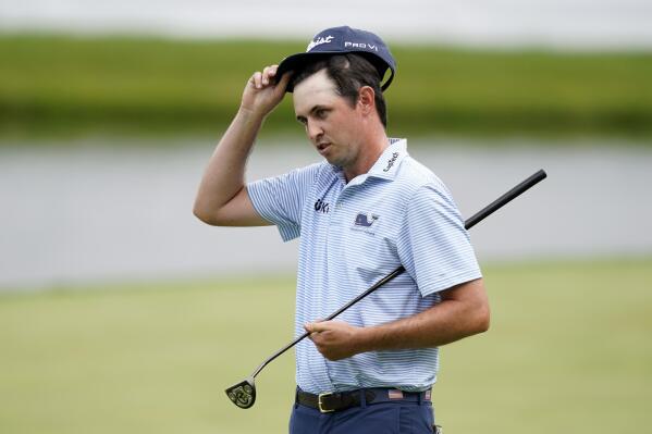J.T. Poston reacts on the 18th green after completing his third round of the John Deere Classic golf tournament, Saturday, July 2, 2022, at TPC Deere Run in Silvis, Ill. (AP Photo/Charlie Neibergall)
