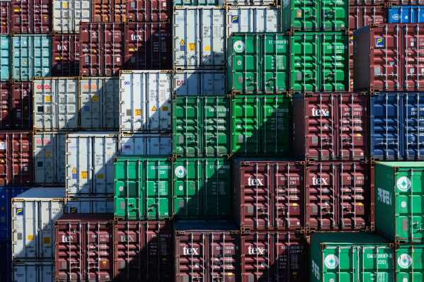 Shipping containers are stacked at Port Botany in Sydney, Australia, Monday, April 7, 2025. (AP Photo/Rick Rycroft)