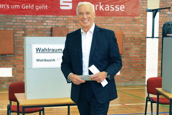 AfD candidate for mayor of Nordhausen, arrives at the polling station to cast his ballot, in Nordhausen, Germany, Sunday, Sept. 24, 2023. The German city of Nordhausen is best known as the location of the former Nazi concentration camp Mittelbau-Dora. A mayoral election on Sunday could again put the focus on the municipality of 42,000 people if a far-right candidate wins the vote. (Silvio Dietzel/dpa via AP)