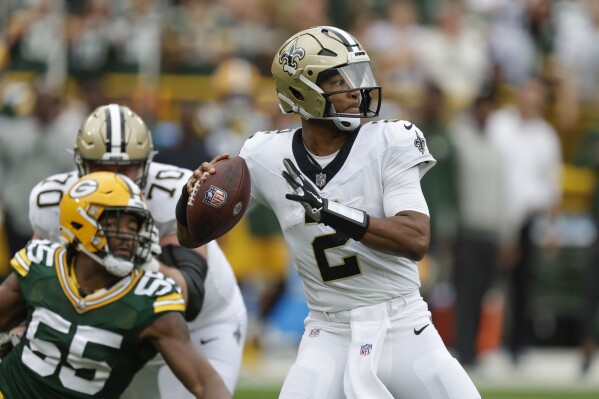 New Orleans Saints quarterback Jameis Winston (2) drops back to pass during the second half of an NFL football game against the Green Bay Packers Sunday, Sept. 24, 2023, in Green Bay, Wis. (AP Photo/Matt Ludtke)