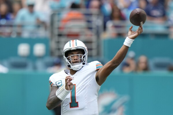 Miami Dolphins quarterback Tua Tagovailoa (1) throws a pass during the second half of an NFL football game against the New England Patriots, Sunday, Oct. 29, 2023, in Miami Gardens, Fla. (AP Photo/Wilfredo Lee)