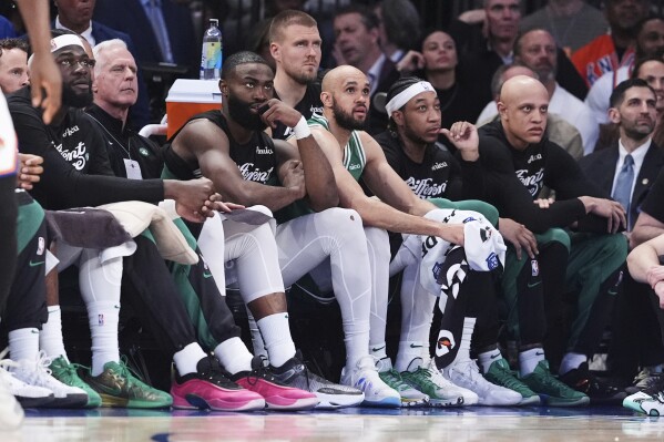 Boston Celtics' Jaylen Brown, third from left, watches with teammates during the second half of Game 6 in the Eastern Conference semifinals of the NBA basketball playoffs against the New York Knicks Friday, May 16, 2025, in New York. (AP Photo/Frank Franklin II)