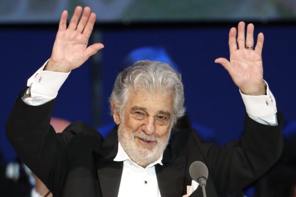 FILE - In this Aug. 28, 2019, file photo, Opera star Placido Domingo performs during a concert in Szeged, Hungary. Italian tenor Andrea Bocelli is staunchly defending Domingo, calling it “absurd” that opera houses have canceled the star’s performances over sexual harassment allegations that haven’t been fully investigated. Three U.S. music companies canceled Domingo appearances following allegations of sexual harassment made by multiple women earlier this year. (AP Photo/Laszlo Balogh, File)