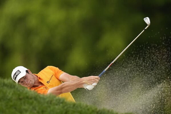 FILE - Viktor Hovland, of Norway, fails to get his ball out of the bunker on the 16th hole during the final round of the PGA Championship golf tournament at Oak Hill Country Club on Sunday, May 21, 2023, in Pittsford, N.Y. The previous day, Corey Conners was in the same bunker and also didn't get it out. (AP Photo/Eric Gay, File)