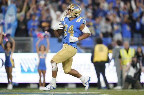 UCLA running back Zach Charbonnet (24) runs to the end zone for a touchdown during the second half of an NCAA college football game against Stanford in Pasadena, Calif., Saturday, Oct. 29, 2022. (AP Photo/Ashley Landis)