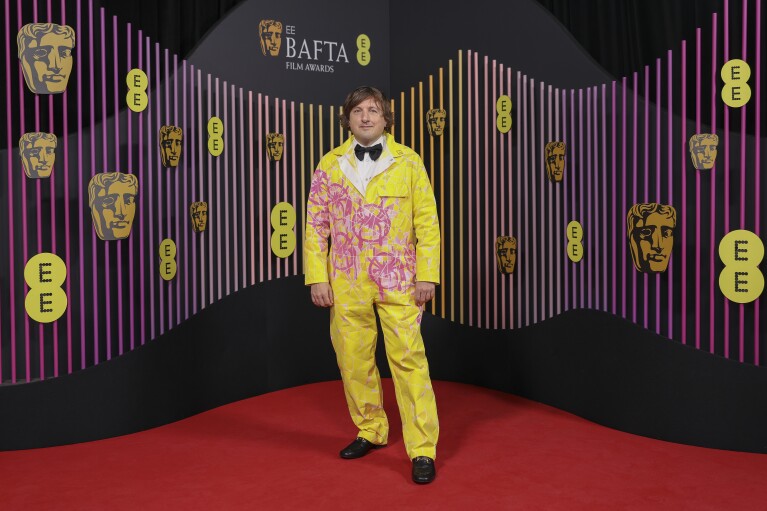 Composer Daniel Pemberton poses for photographers upon arrival at the 77th British Academy Film Awards, BAFTA's, in London, Sunday, Feb. 18, 2024. (Photo by Vianney Le Caer/Invision/AP)