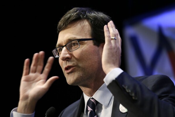 FILE - Attorney General Bob Ferguson speaks at an election night party for Democrats on Nov. 8, 2016, in Seattle. (AP Photo/Elaine Thompson, File)