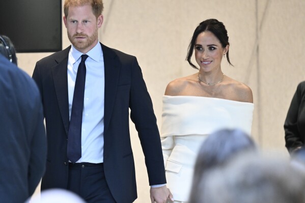 FILE - Britain's Prince Harry, The Duke of Sussex, left, and Meghan, Duchess of Sussex, participate in The Archewell Foundation Parents' Summit "Mental Wellness in the Digital Age" as part of Project Healthy Minds' World Mental Health Day Festival, Oct. 10, 2023, in New York. Prince Harry and his wife, Meghan, will visit Nigeria in May 2024 for talks on the Invictus Games, which he founded to aid the rehabilitation of wounded and sick servicemembers and veterans, a Nigerian official said Sunday, April 28, 2024. (Photo by Evan Agostini/Invision/AP, File)