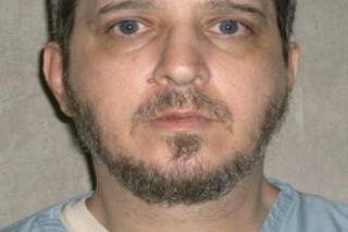FILE - This undated file photo provided by the Oklahoma Department of Corrections shows death row inmate Richard Glossip. A Texas law firm says it has at least 20 attorneys ready to review the case of an Oklahoma death row inmate waiting to be executed. A group of Republican House members announced Tuesday, Feb. 22, 2022 the Houston-based firm ReedSmith has agreed to review the case for free. (Oklahoma Department of Corrections via AP, File)