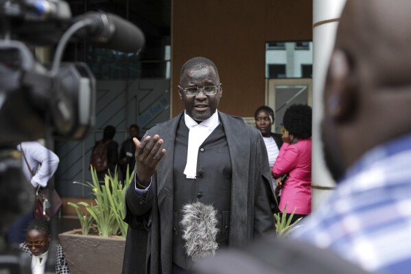 Nicholas Opiyo, Petitioner and Human rights advocate, speaks to journalists outside the Constitutional Court in Kampala, Uganda, Wednesday, April 3, 2024, after Uganda's Constitutional Court gave its seal of approval on the anti-homosexuality law, declaring that the Anti Homosexuality Act of 2023 complies with the Constitution of Uganda. (AP Photo/Hajarah Nalwadda )