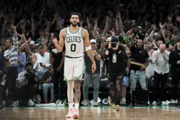 Boston Celtics forward Jayson Tatum (0) reacts as time winds off the clock in overtime of Game 1 of the NBA Eastern Conference basketball finals against the Indiana Pacers, Tuesday, May 21, 2024, in Boston. (AP Photo/Charles Krupa)
