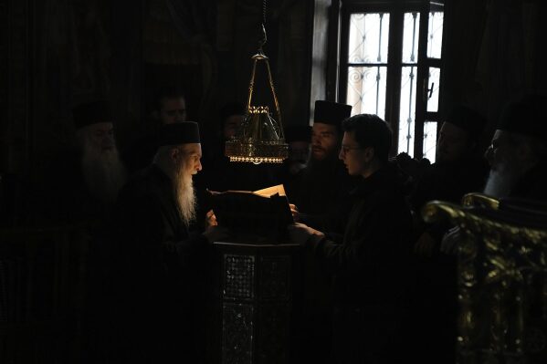 Monks pray during the afternoon liturgy at the Simonopetra, or Simonos Petra Monastery, home of the all-male autonomous community Agion Oros, or Holy Mountain, on the peninsula of Mount Athos in northern Greece, April 14, 2025. (AP Photo/Thanassis Stavrakis)