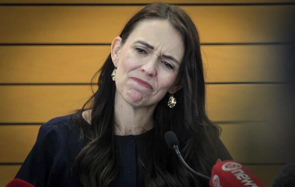 New Zealand Prime Minister Jacinda Ardern grimaces as she announces her resignation at a press conference in Napier, New Zealand Thursday, Jan. 19, 2023. Ardern says that she will not contest this year's general elections. (Warren Buckland/New Zealand Herald via AP)