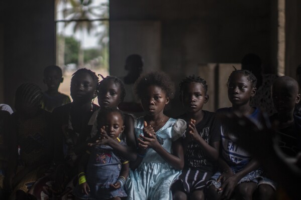 Children attend Christmas mass in a church in their village of Kimbanza, in Moanda, Democratic Republic of the Congo, Monday, Dec. 25, 2023. (AP Photo/Mosa'ab Elshamy)