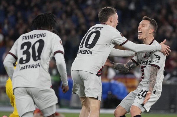 Bayer Leverkusen's record unbeaten march continues with a 2-0 win at Roma  in Europa League | AP News