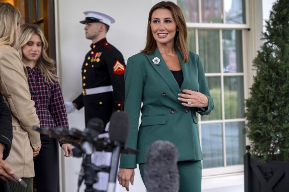 Alina Habba, a former defense lawyer for President Donald Trump who has been named interim U.S. Attorney for New Jersey, walks toward the microphones to speak to members of the media, Monday, March 24, 2025, outside the White House in Washington. (AP Photo/Jacquelyn Martin)