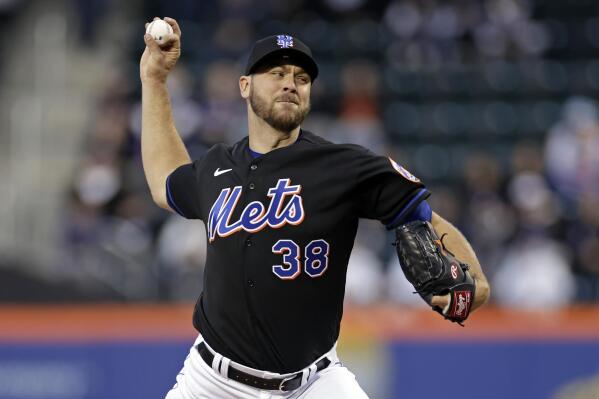 New York Mets pitcher Tylor Megill throws during the first inning of the team's baseball game against the Philadelphia Phillies on Friday, April 29, 2022, in New York. (AP Photo/Adam Hunger)