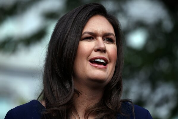 FILE - In this Wednesday, May 22, 2019, file photo, White House press secretary Sarah Sanders talks with reporters outside the White House, in Washington. Former White House spokeswoman Sanders is running for Arkansas governor, a source told The Associated Press, late Sunday, Jan. 24, 2021. (AP Photo/Evan Vucci, File)