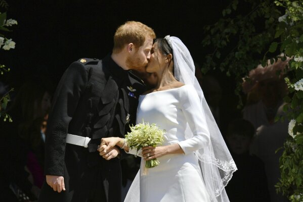 Prince Harry and Meghan Markle leave after their wedding ceremony at St. George's Chapel in Windsor Castle in Windsor, near London, England, Saturday, May 19, 2018. (Ben Birchhall/pool photo via AP)