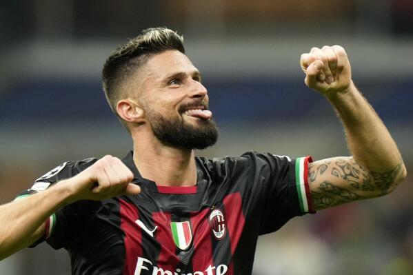 AC Milan's Olivier Giroud celebrates at the end of the Champions League, Group E soccer match between AC Milan and FC Salzburg, at the San Siro stadium in Milan, Italy, Wednesday, Nov. 2, 2022. (AP Photo/Luca Bruno)
