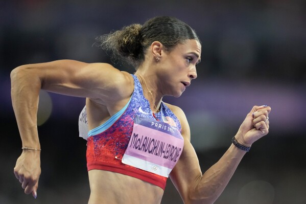 Sydney McLaughlin-Levrone, of the United States competes in the women's 400 meters hurdles final at the 2024 Summer Olympics, Thursday, Aug. 8, 2024, in Saint-Denis, France. (AP Photo/Ashley Landis)